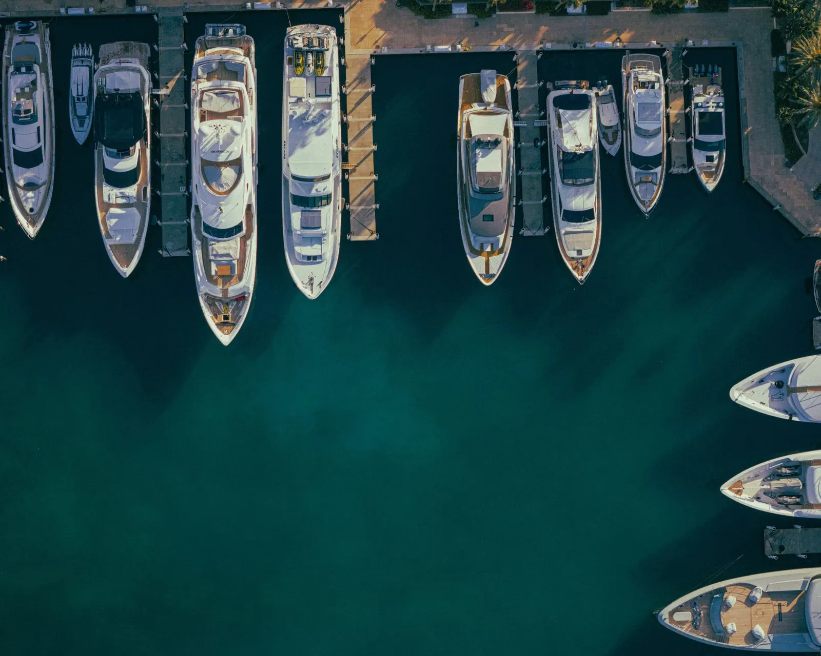 Aerial view of motor yachts moored side by side in a marina